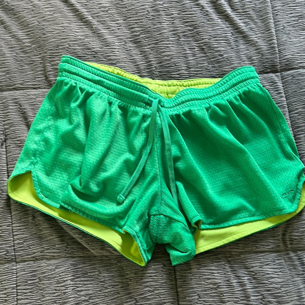 Green athletic shorts.